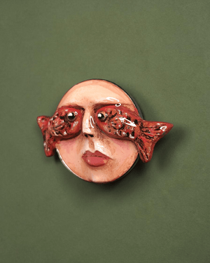 Face with Fish Eyes Pin Button ā Handmade Clay & Resin Surreal Wearable Art with Stainless Steel Pin Back - SAMA