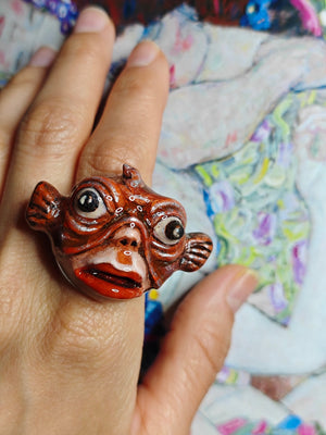 Face with Fish Mask Ring ā Handmade Clay & Resin Surreal Statement Jewelry with Adjustable Stainless Steel Band - SAMA