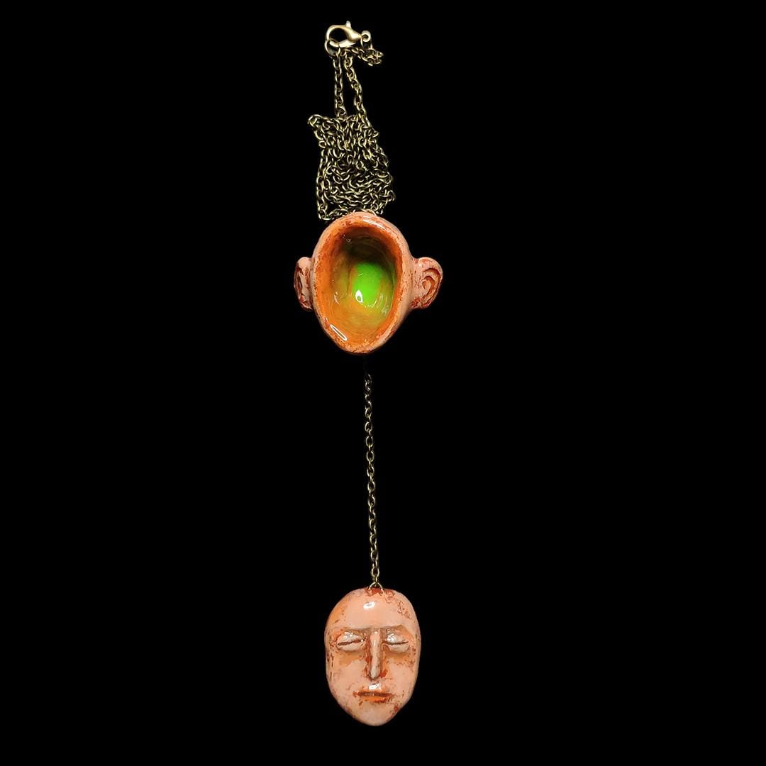Glowing Hollow Head Necklace ā Handmade Clay & Resin Surreal Statement Jewelry with Face on Chain, Sculptural Wearable Art OOAK