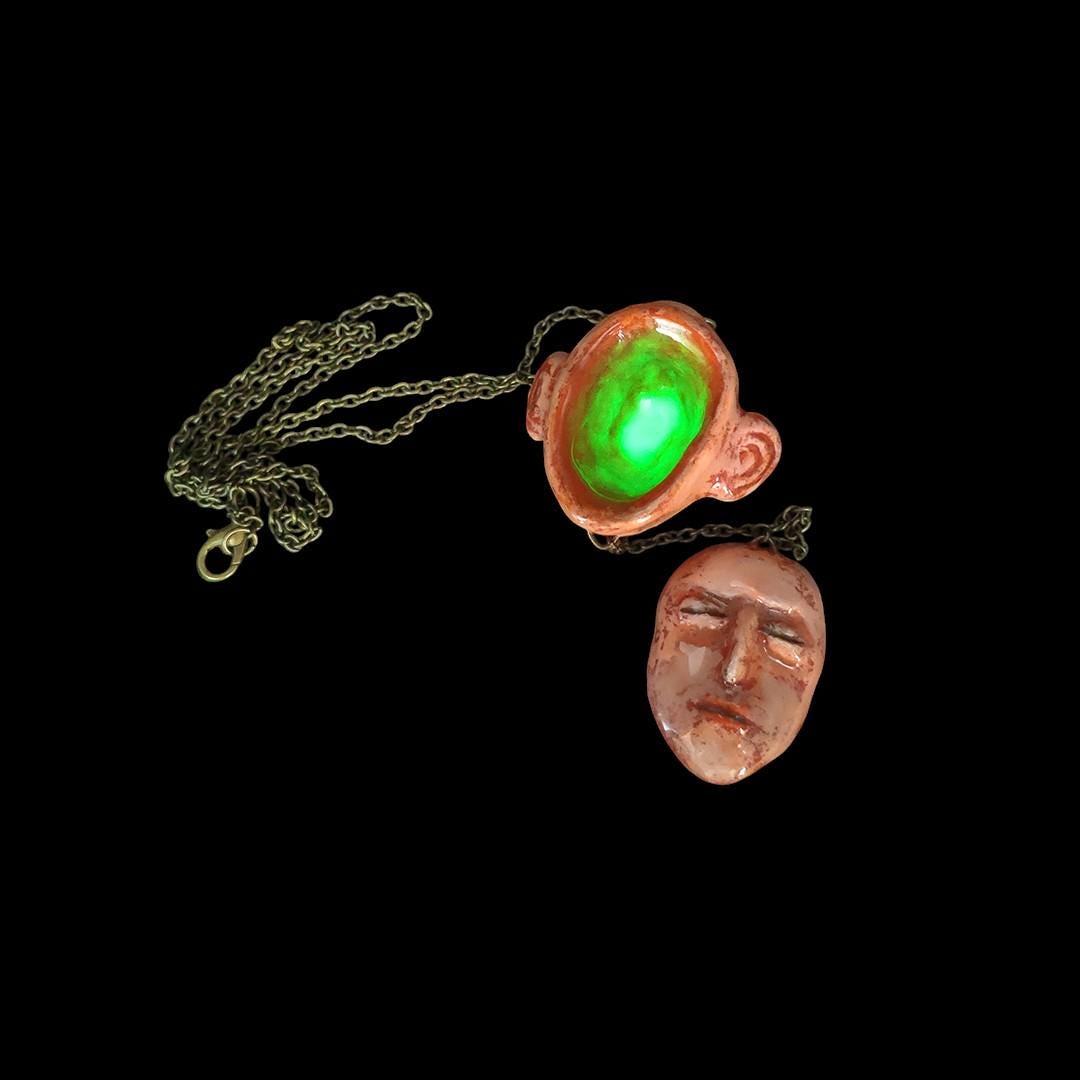 Glowing Hollow Head Necklace ā Handmade Clay & Resin Surreal Statement Jewelry with Face on Chain, Sculptural Wearable Art OOAK