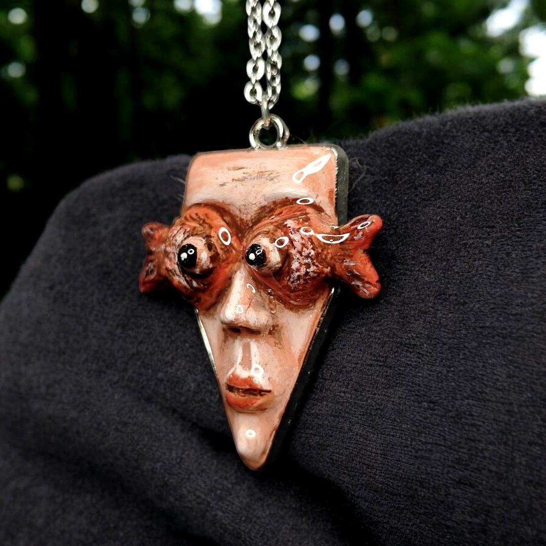 Face with Fish Eye Necklace ā Handmade Clay & Resin Surreal Statement Jewelry, Sculptural Wearable Art with Alloy Pendant / Chain