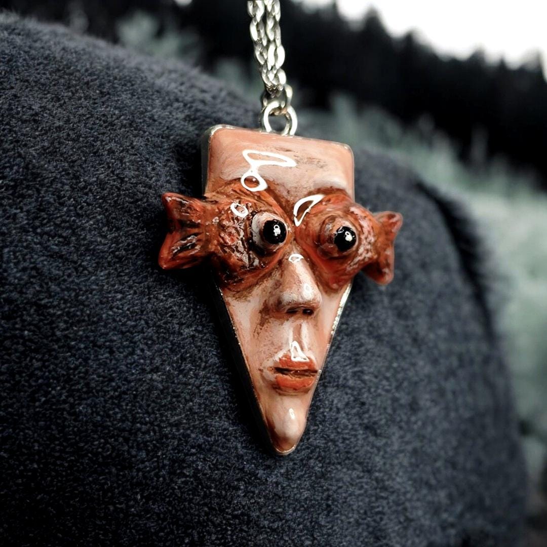 Face with Fish Eye Necklace ā Handmade Clay & Resin Surreal Statement Jewelry, Sculptural Wearable Art with Alloy Pendant / Chain