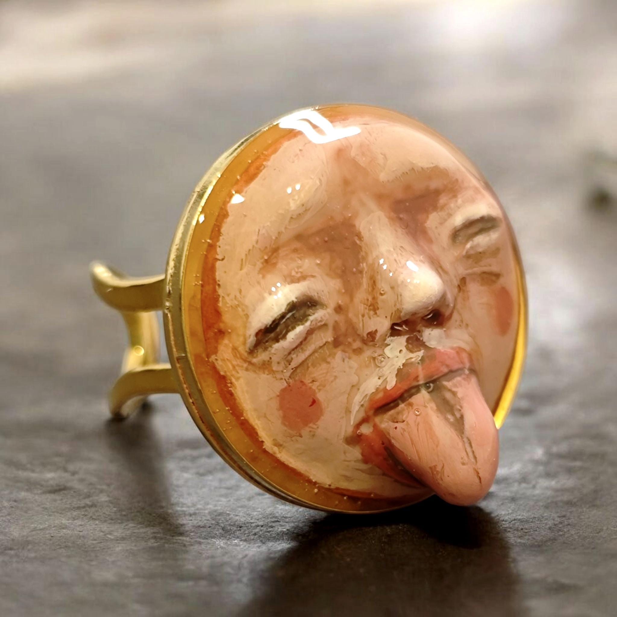 Tongue Out Face Ring ā Handmade Clay & Resin Surreal Statement Jewelry, Closed Eyes Sculptural Wearable Art, Adjustable Stainless Steel Band